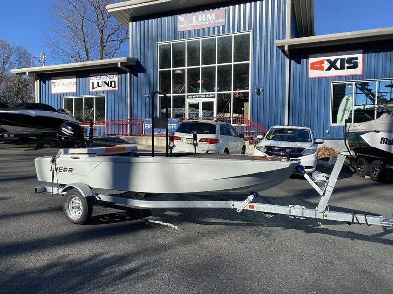 The Image of 2024 Veer V13 boat on trailer outside dealership, surrounded by cars and other boats. - 1