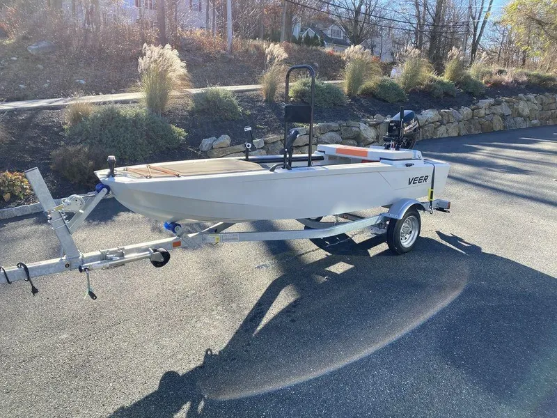 Slide: The Image of 2024 Veer V13 boat on trailer in sunny outdoor setting. - 6