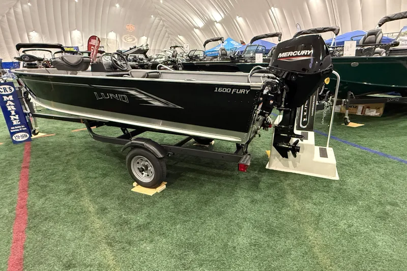 The Image of 2024 Lund 1600 Fury SS boat on display with Mercury outboard motor. - 0