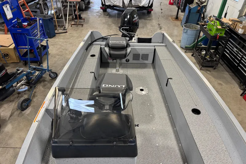 Slide: The Image of 2024 Lund 1600 Fury SS boat interior in a workshop setting. - 28