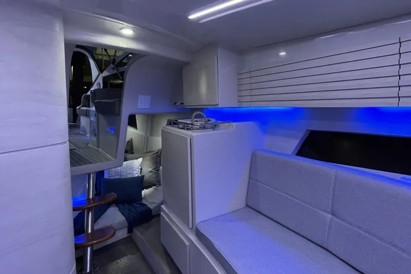 Slide: The Image of Modern interior of 2023 Real 35 Special Deck (SD) boat with blue LED lighting. - 12