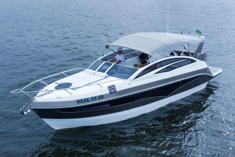 Slide: The Image of 2023 Real 35 Special Deck (SD) boat cruising on water. - 3