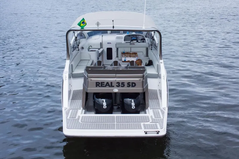 Slide: The Image of 2023 Real 35 Special Deck (SD) boat on water, rear view. - 5