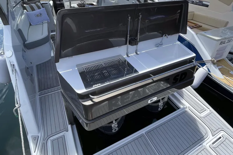 Slide: The Image of Real 35 Special Deck (SD) 2023 boat with open rear deck and built-in grill. - 6