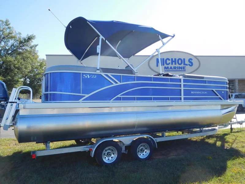 Slide: The Image of 2024 Bennington 22 SVSR pontoon boat with blue canopy at Nichols Marine. - 0