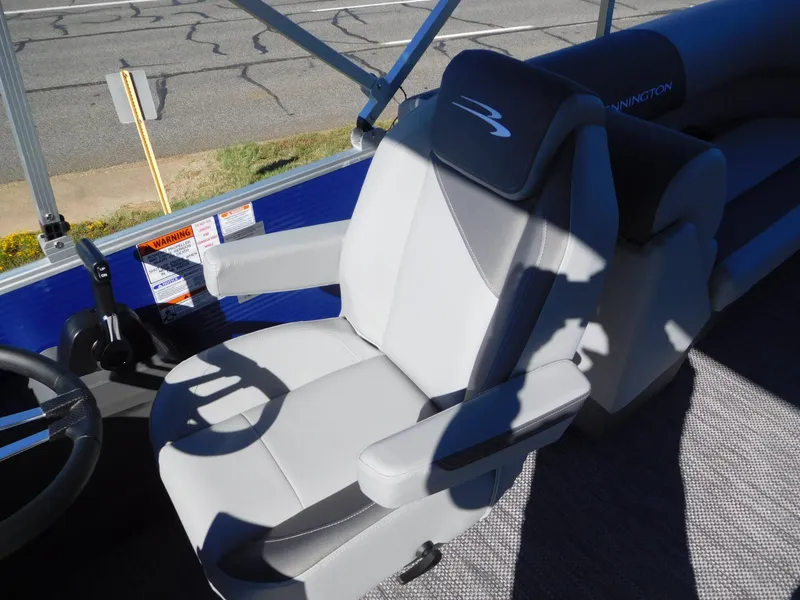 Slide: The Image of 2024 Bennington 22 SVSR captain's chair with armrests and steering wheel. - 3