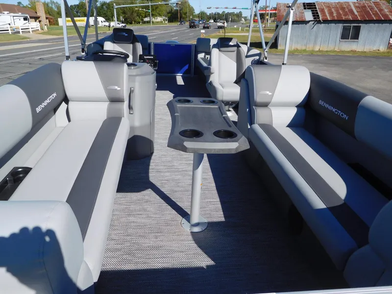Slide: The Image of 2024 Bennington 22 SVSR pontoon boat interior with gray seating and cup holders. - 5