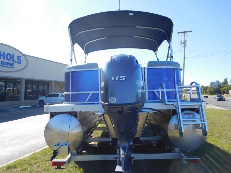Slide: The Image of 2024 Bennington 22 SVSR pontoon boat with 115 HP engine at a dealership. - 9