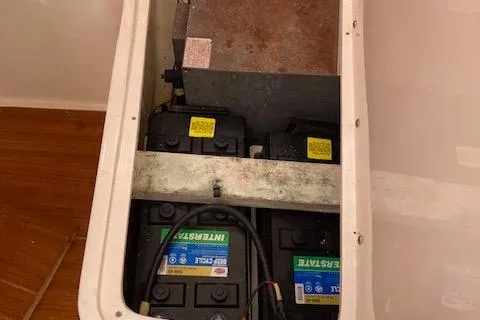 Slide: The Image of Battery compartment of a 2002 Catalina 34MK II sailboat, featuring dual marine batteries. - 10
