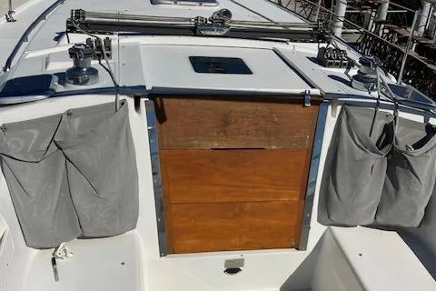 Slide: The Image of 2002 Catalina 34MK II sailboat cockpit with wooden hatch and storage pouches. - 17