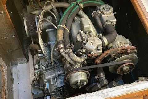 Slide: The Image of Engine compartment of a 2002 Catalina 34MK II sailboat, showcasing mechanical components. - 24