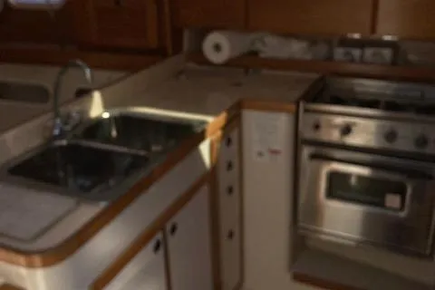 Slide: The Image of 2002 Catalina 34MK II yacht kitchen with sink and stove. - 9