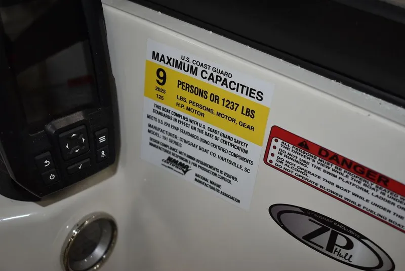 Slide: The Image of 2024 Stingray 191DC boat capacity label, US Coast Guard maximum capacities, 9 persons or 1237 lbs. - 14