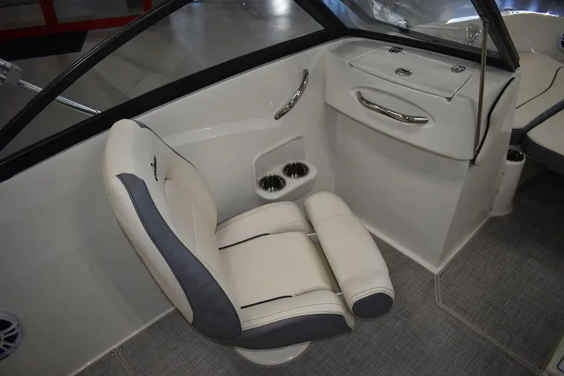 Slide: The Image of 2024 Stingray 191DC boat interior with white and gray seating. - 17