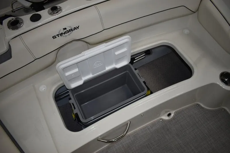 Slide: The Image of 2024 Stingray 191DC boat with open storage compartment. - 20