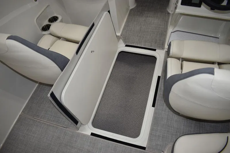 Slide: The Image of 2024 Stingray 191DC boat interior with storage compartment and seating. - 23