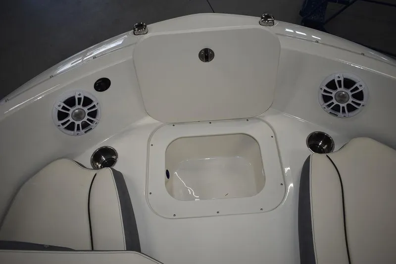 Slide: The Image of 2024 Stingray 191DC boat interior with seating, speakers, and storage compartment. - 26
