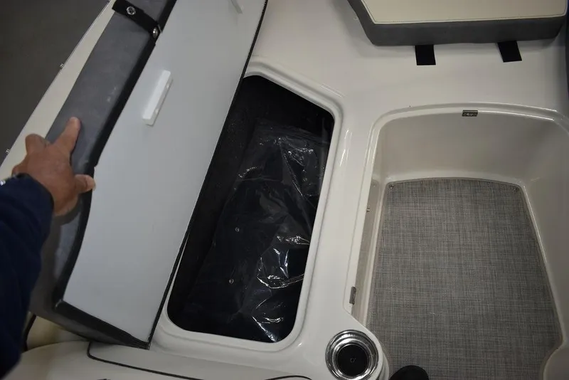 Slide: The Image of 2024 Stingray 191DC boat storage compartments and seating area. - 29