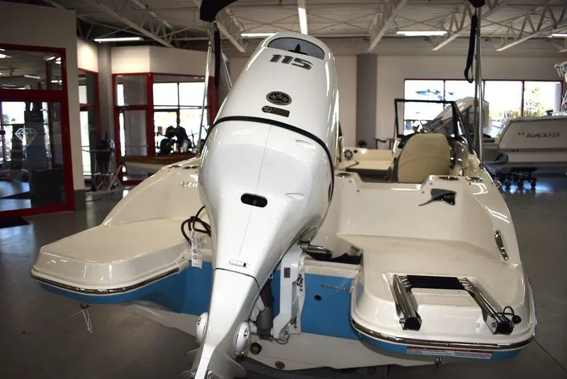 Slide: The Image of 2024 Stingray 191DC boat with 115 HP engine in showroom. - 4