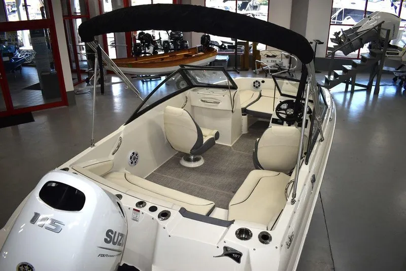 Slide: The Image of 2024 Stingray 191DC boat interior with Suzuki 115 outboard motor in showroom. - 6