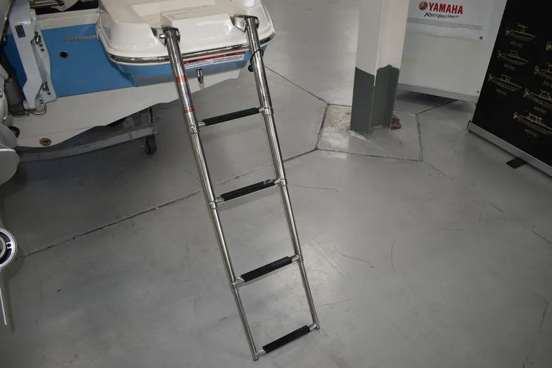 Slide: The Image of 2024 Stingray 191DC boat with extended stainless steel ladder in showroom. - 8