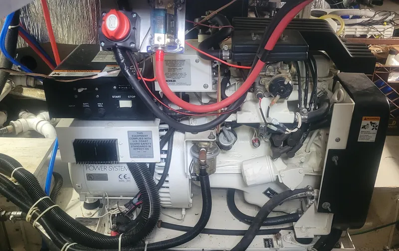 Slide: The Image of Engine room of a 2001 Carver 396 Motor Yacht with visible wiring and components. - 15