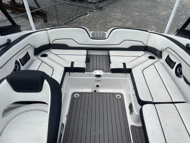 Slide: The Image of 2018 Yamaha Boats AR210 interior seating and deck area. - 14