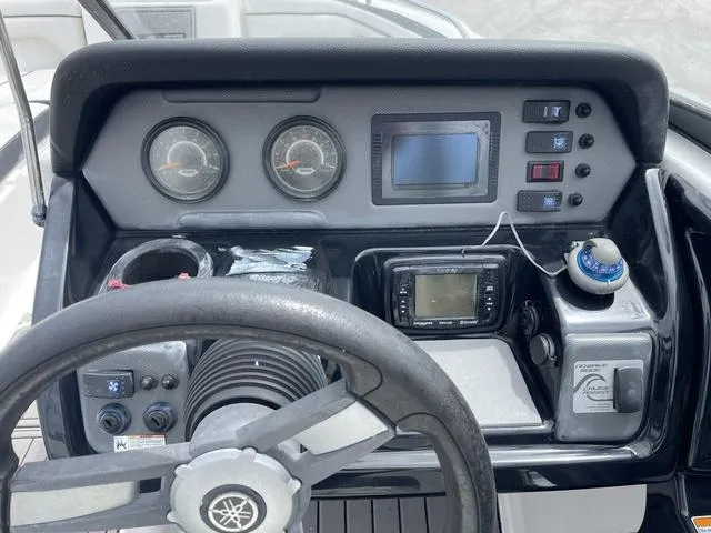 Slide: The Image of 2018 Yamaha Boats AR210 dashboard with steering wheel, gauges, and control panel. - 17