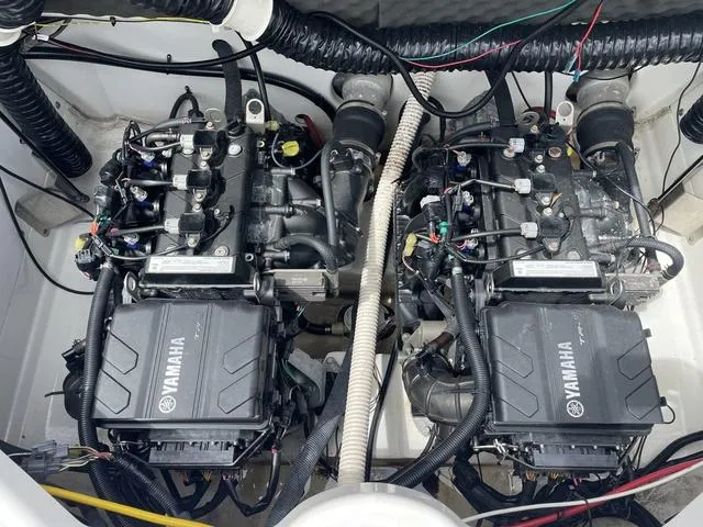 Slide: The Image of Twin engines of a 2018 Yamaha Boats AR210. - 18