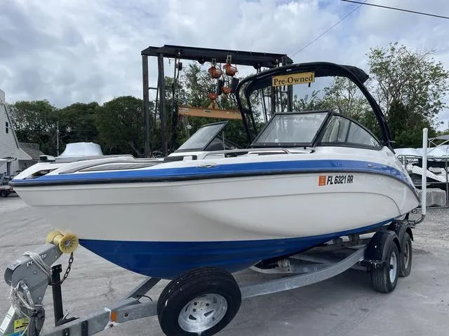 Slide: The Image of 2018 Yamaha Boats AR210 pre-owned on trailer, ready for sale. - 2