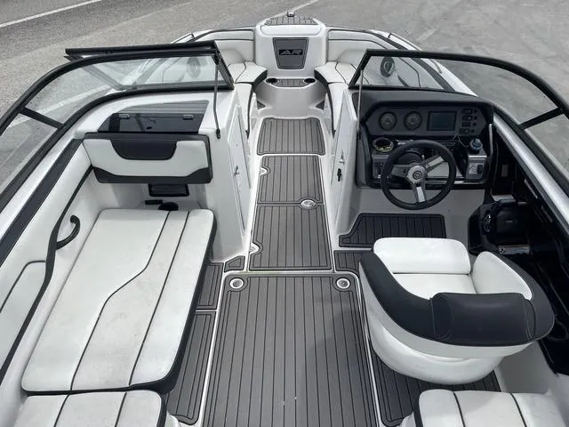 Slide: The Image of 2018 Yamaha Boats AR210 interior with seating and steering console. - 7