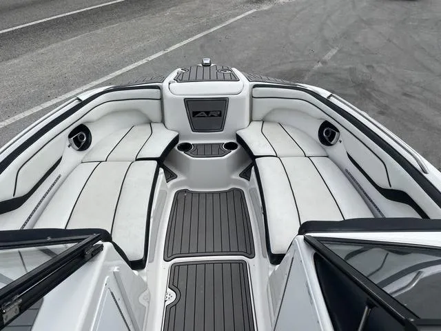 Slide: The Image of 2018 Yamaha Boats AR210 interior seating and deck view. - 8