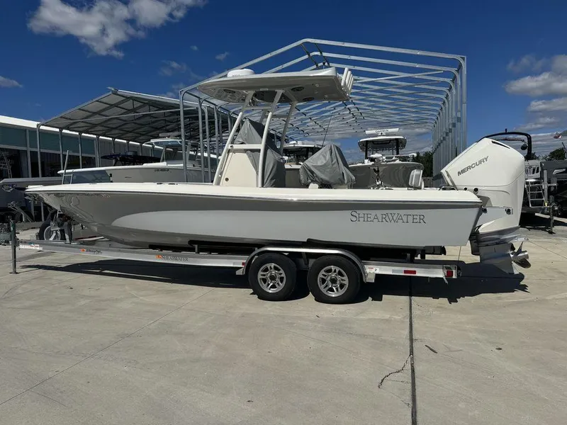 The Image of 2023 ShearWater 270 Carolina Open boat on a trailer in a marina. - 1
