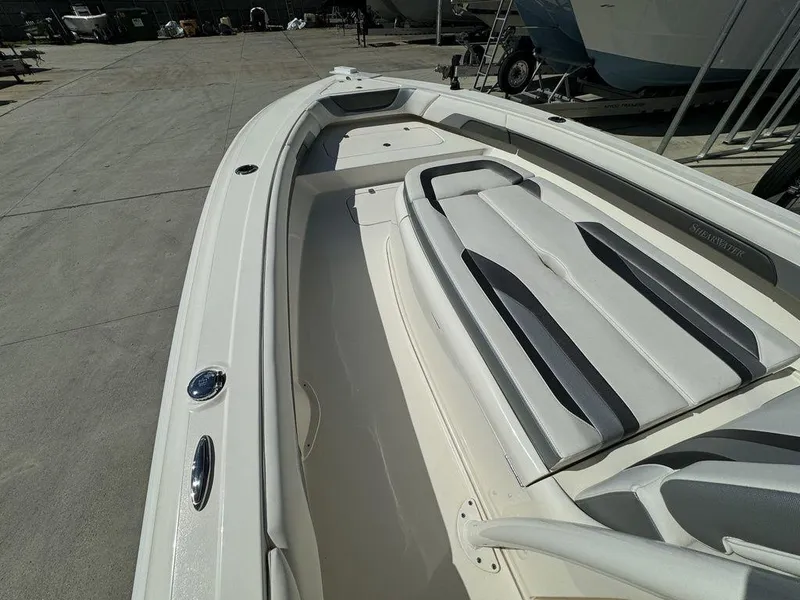 Slide: The Image of 2023 ShearWater 270 Carolina Open boat interior with seating and deck view. - 13
