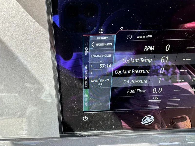 Slide: The Image of 2023 ShearWater 270 Carolina Open boat dashboard displaying engine hours and maintenance data. - 17