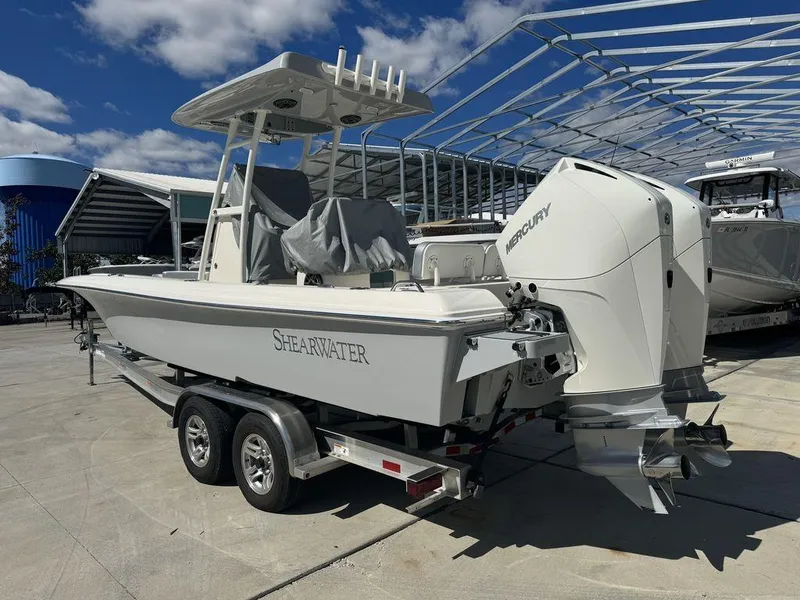 Slide: The Image of 2023 ShearWater 270 Carolina Open boat on a trailer with twin Mercury engines. - 6