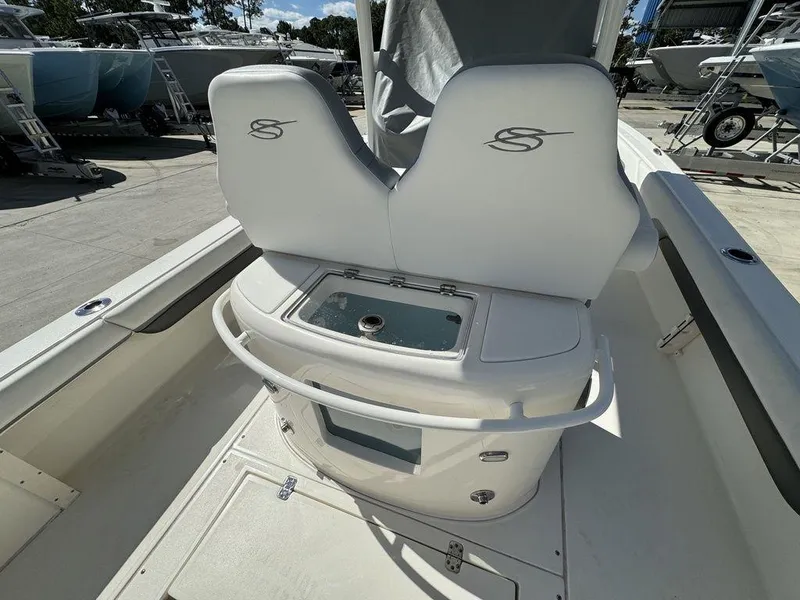 Slide: The Image of 2023 ShearWater 270 Carolina Open boat interior with dual seats and storage. - 9