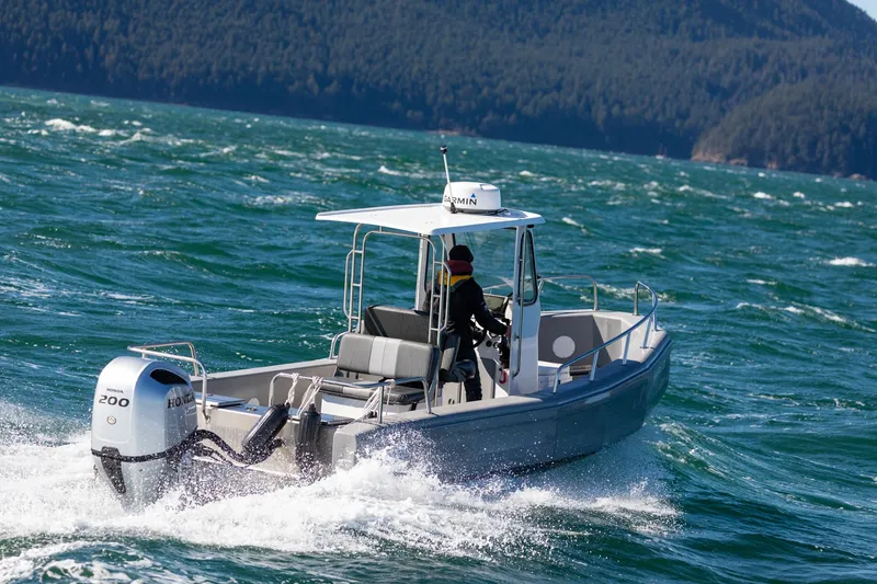 Slide: The Image of 2022 Bullfrog 22' Offshore Ranger boat cruising on open water. - 2