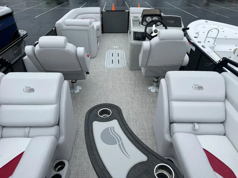 Slide: The Image of 2024 SunCatcher Select 322RC pontoon boat interior with plush seating and modern helm. - 13