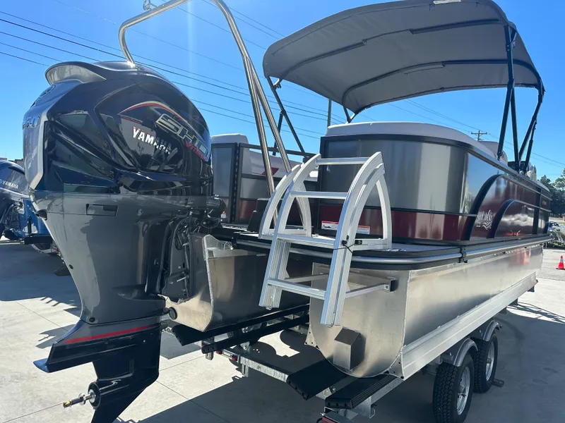 Slide: The Image of 2024 SunCatcher Select 322RC pontoon boat with Yamaha outboard motor and canopy. - 21