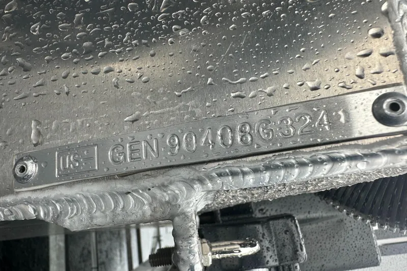 Slide: The Image of 2024 SunCatcher Select 322RC serial number plate with water droplets. - 25