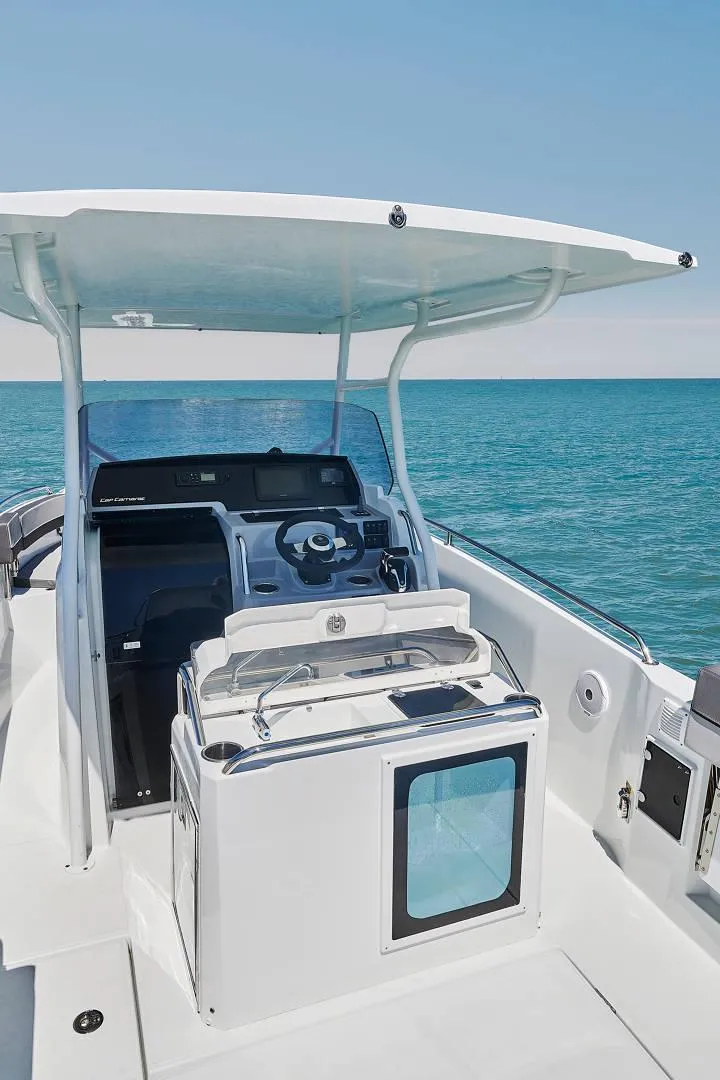 Slide: The Image of 2024 Jeanneau Leader 7.5 CC S3 boat interior with seating and storage. - 10