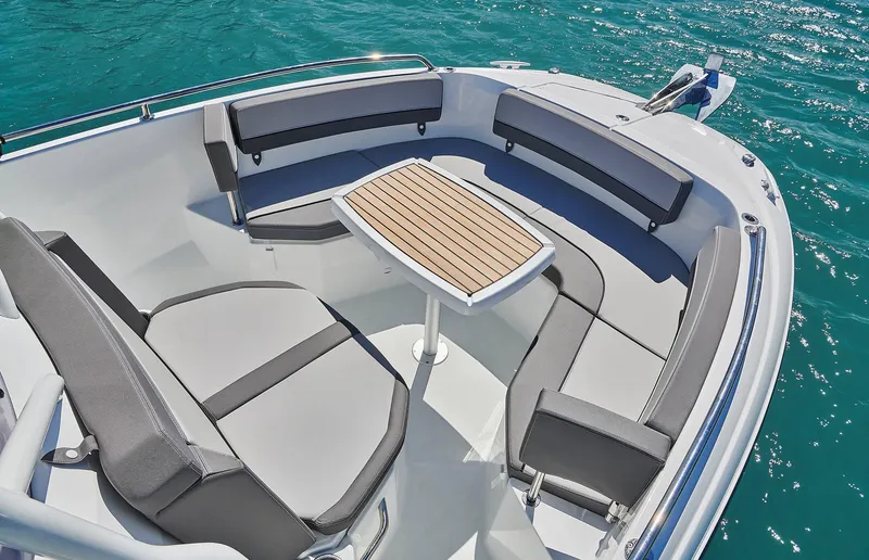 Slide: The Image of 2024 Jeanneau Leader 7.5 CC S3 boat cockpit with helm and seating. - 12
