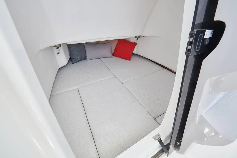 Slide: The Image of 2024 Jeanneau Leader 7.5 CC S3 boat with spacious seating and table on turquoise water. - 14