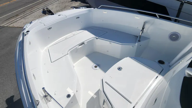 Slide: The Image of 2024 Jeanneau Leader 7.5 CC S3 boat interior with spacious seating and storage compartments. - 26