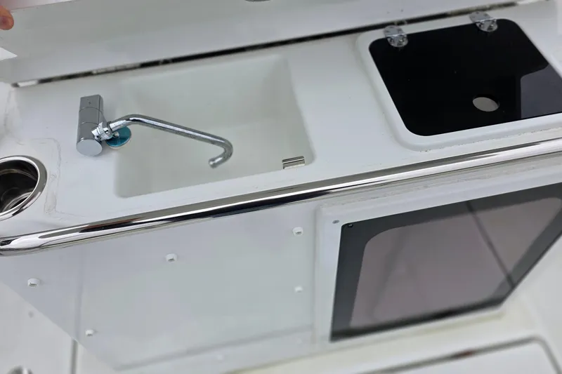 Slide: The Image of 2024 Jeanneau Leader 7.5 CC Series 3 boat sink and storage area. - 32