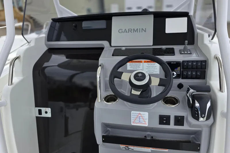 Slide: The Image of 2024 Jeanneau Leader 7.5 CC Series 3 helm with Garmin navigation system. - 33