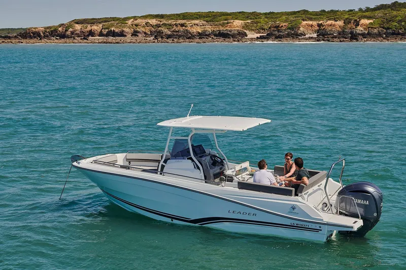 Slide: The Image of 2024 Jeanneau Leader 7.5 CC S3 boat cruising on clear blue water. - 4