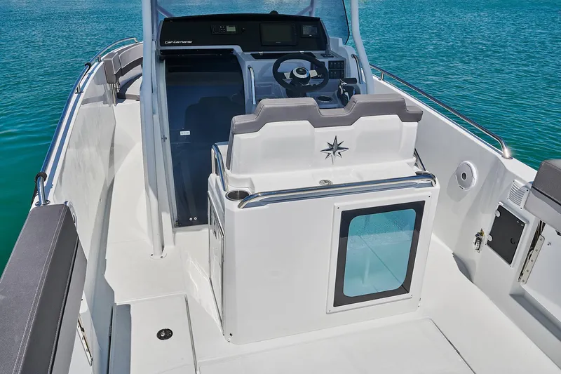Slide: The Image of 2024 Jeanneau Leader 7.5 CC S3 boat interior with steering console and seating. - 9