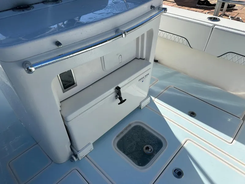 Slide: The Image of 2012 Contender 32 LS boat deck with storage compartment and livewell. - 11